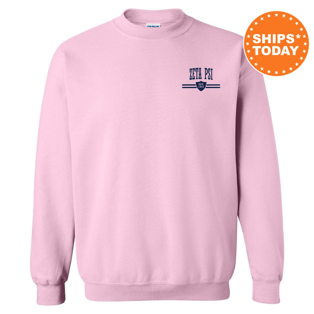 a pink sweatshirt with a blue and white logo