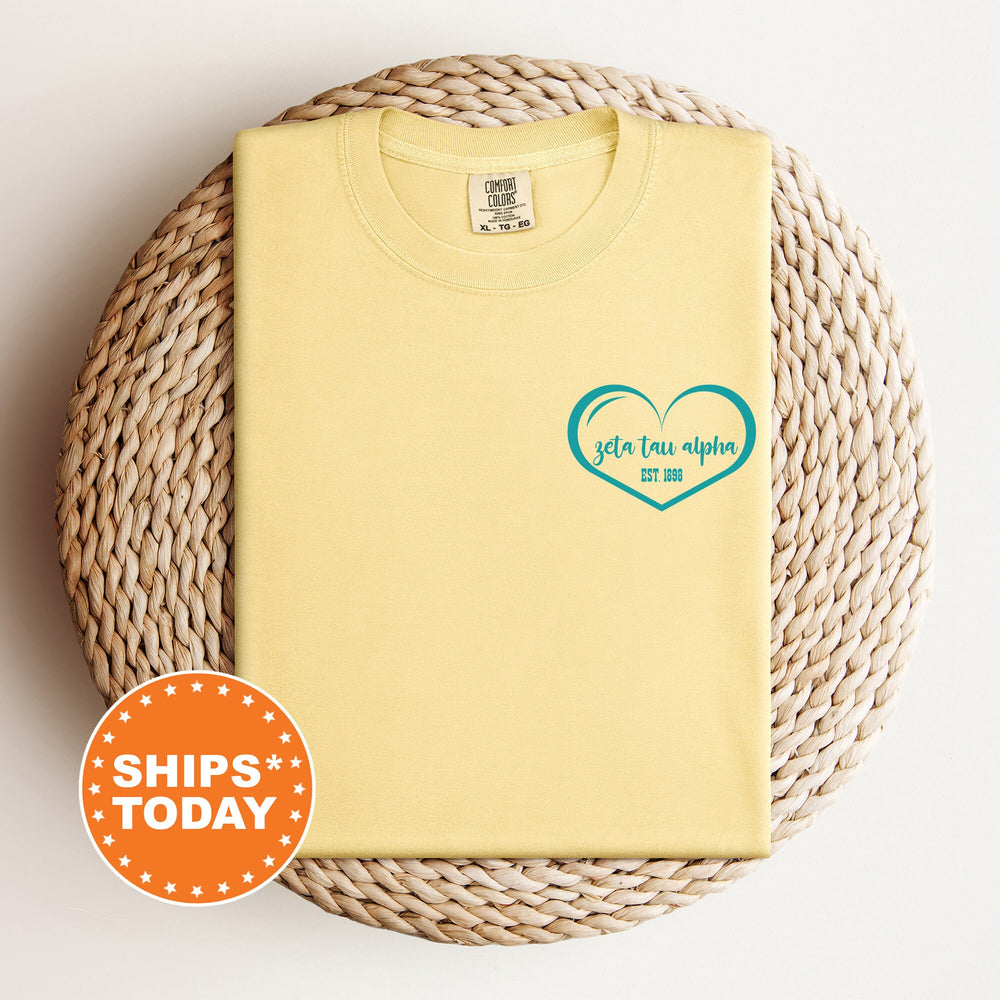 a yellow t - shirt with a heart on it
