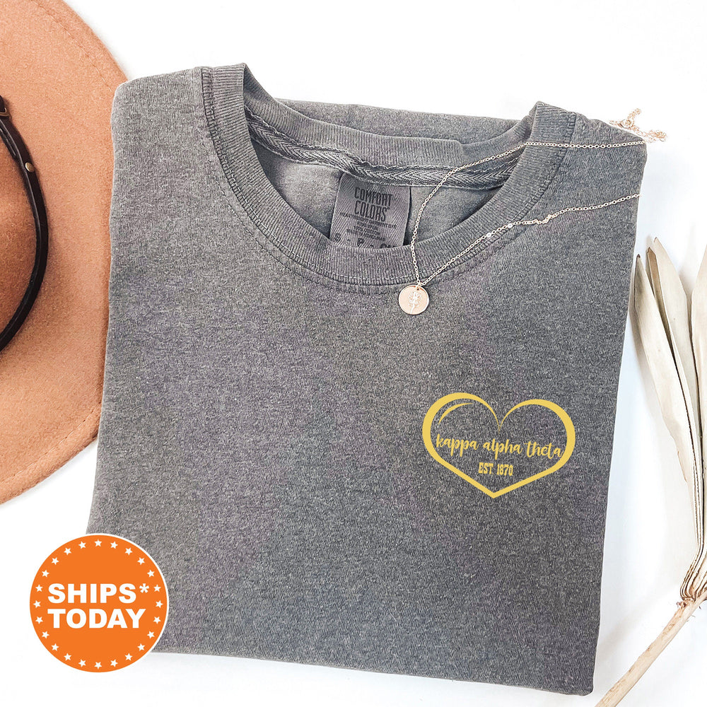 a hat, sunglasses, and a t - shirt with a heart on it