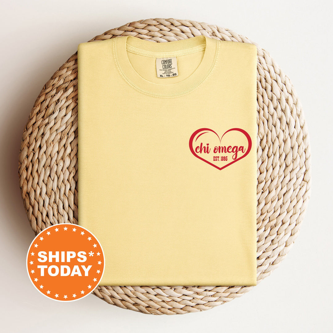 a yellow shirt with a red heart on it