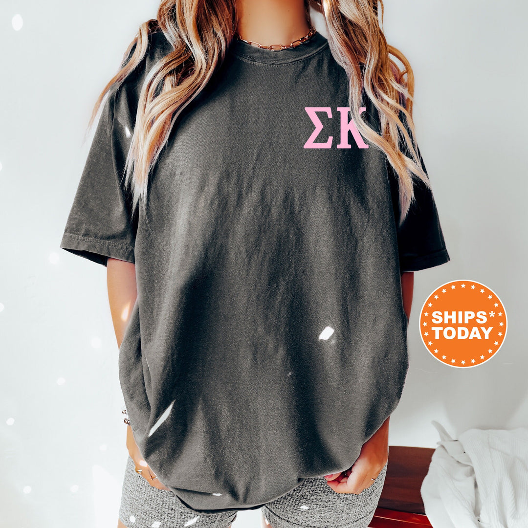 a woman wearing shorts and a t - shirt with the letter k on it