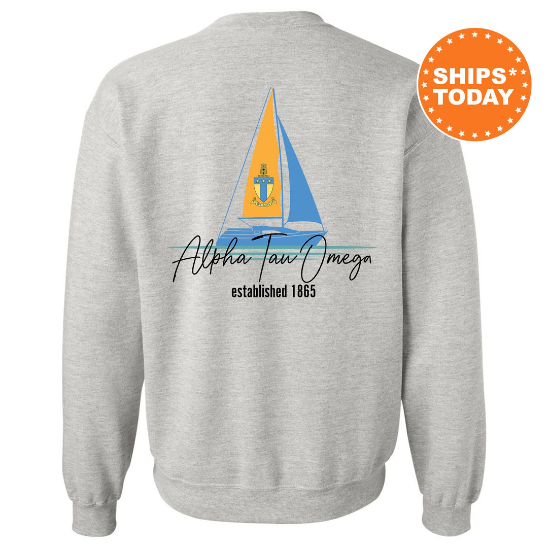 a grey sweatshirt with a sailboat on it
