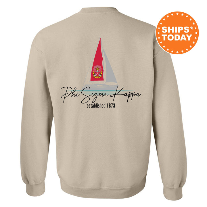 a sweatshirt with a sailboat on the front and a red sailboat on the
