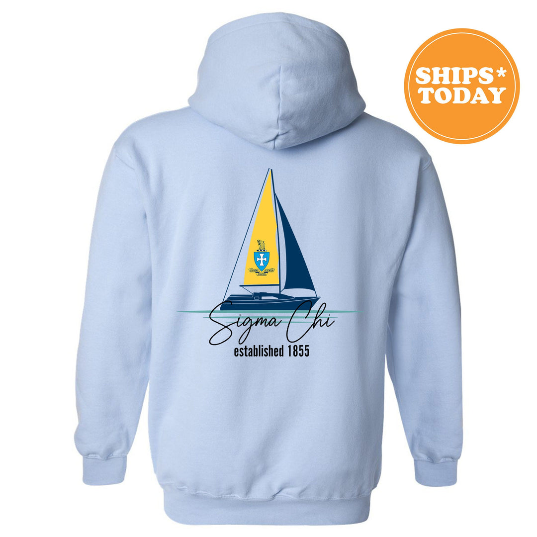 a light blue hoodie with a sailboat on it