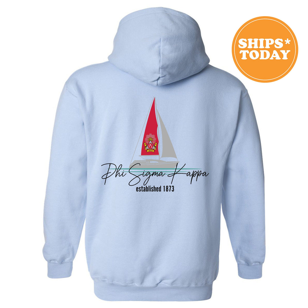 a blue hoodie with a red sailboat on it