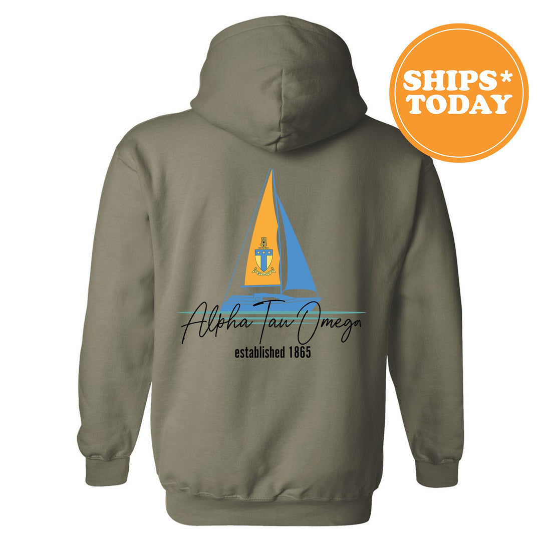 a gray hoodie with a sail boat on it