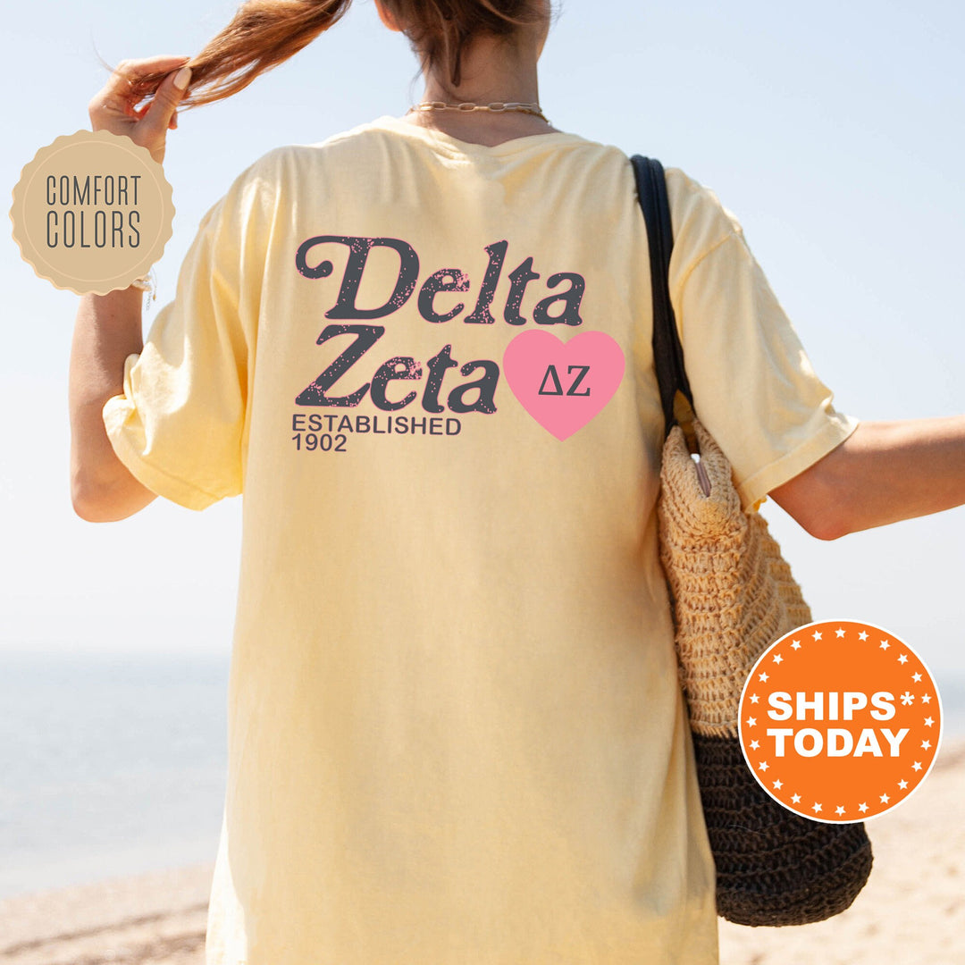 the back of a woman&#39;s yellow delta zeta t - shirt