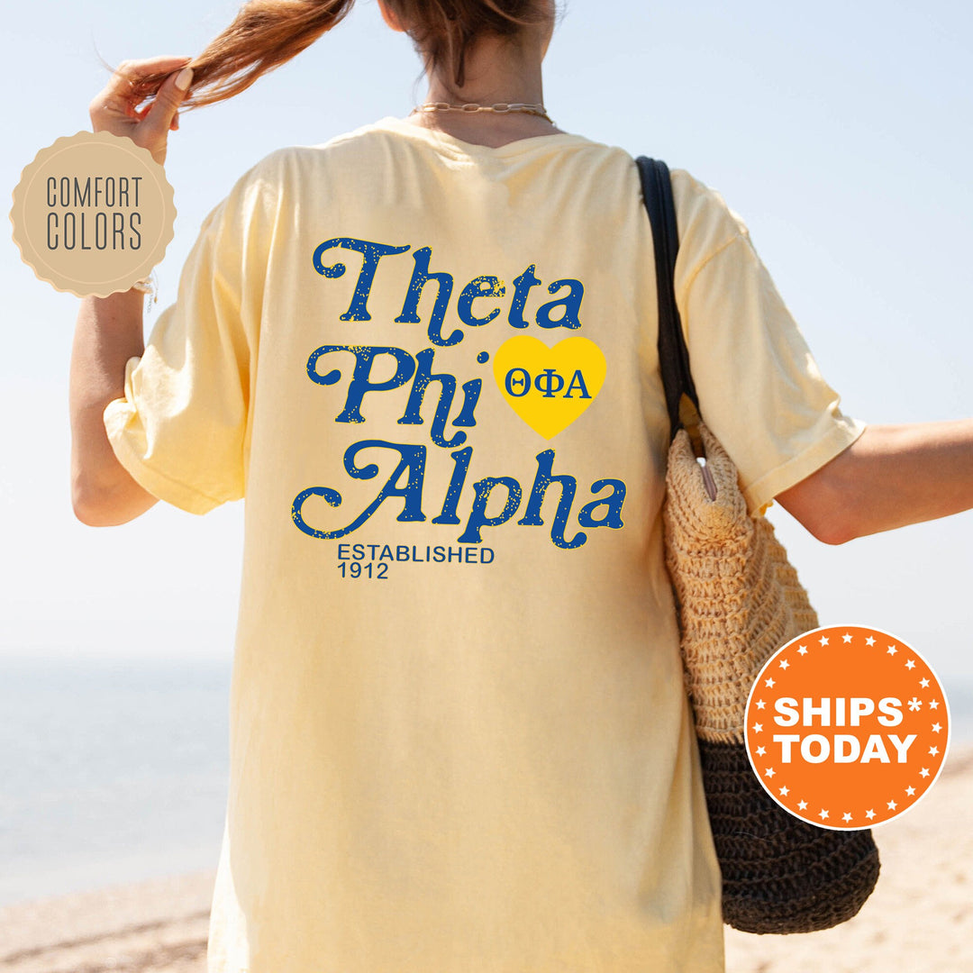 the back of a woman&#39;s shirt that says, thea phi phi phi