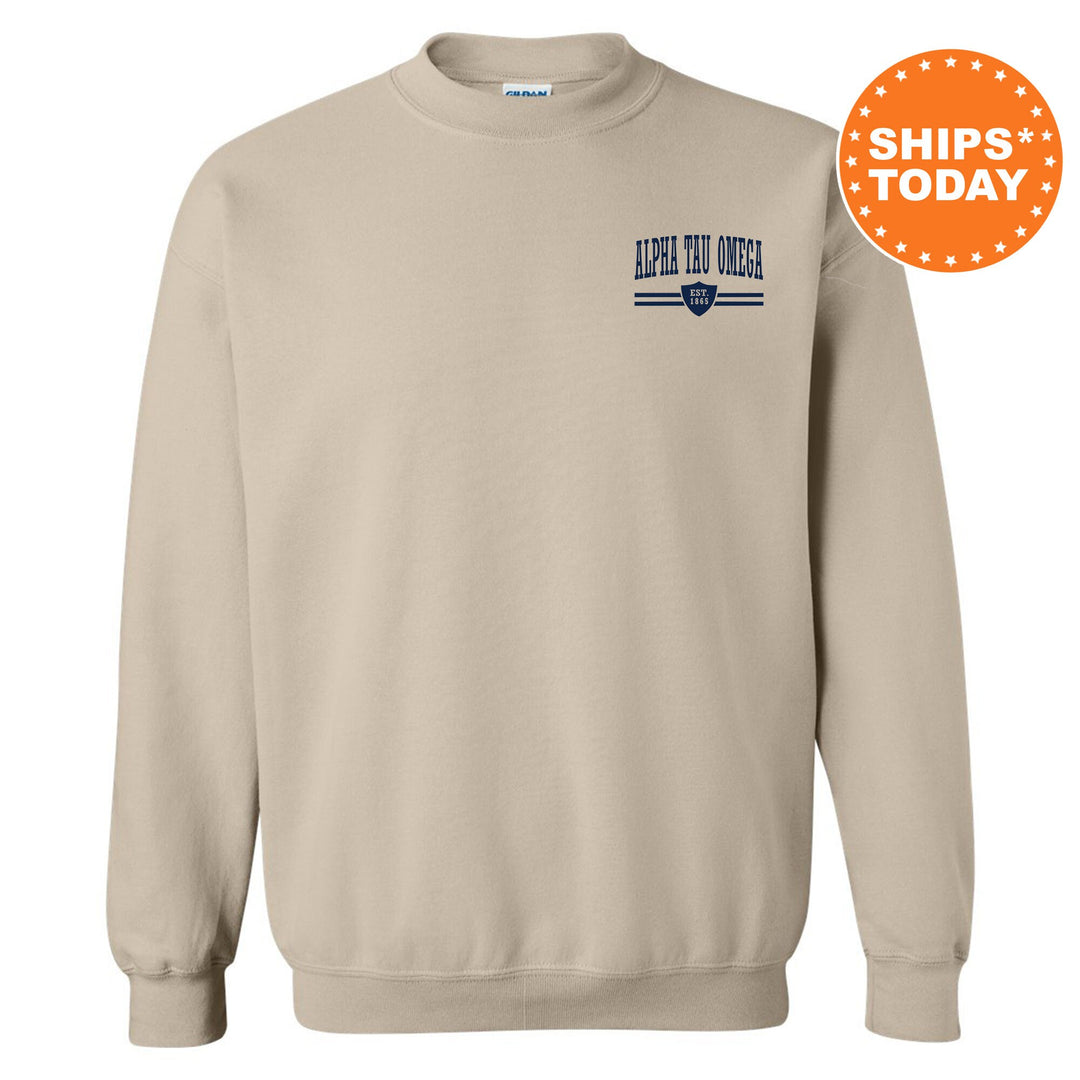 a beige sweatshirt with a blue and white stripe on the chest