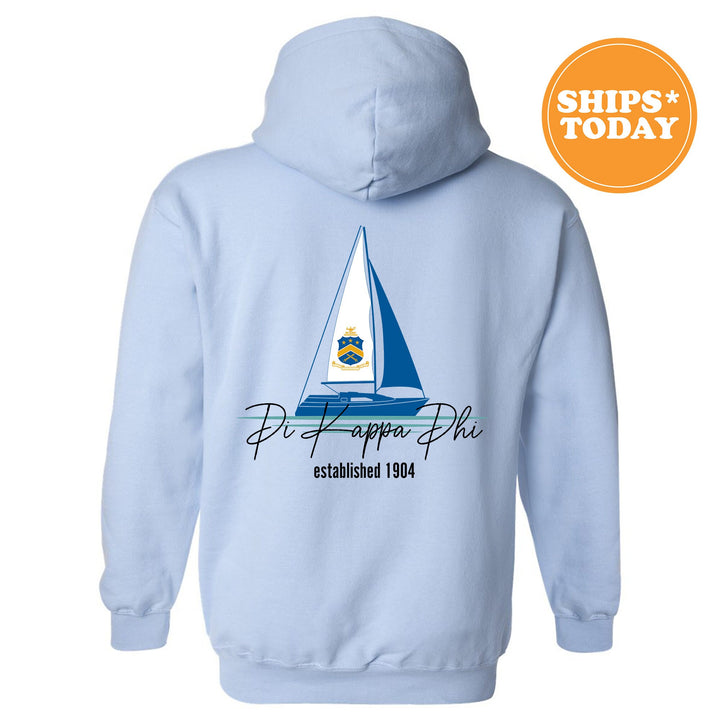 a light blue hoodie with a sailboat on it