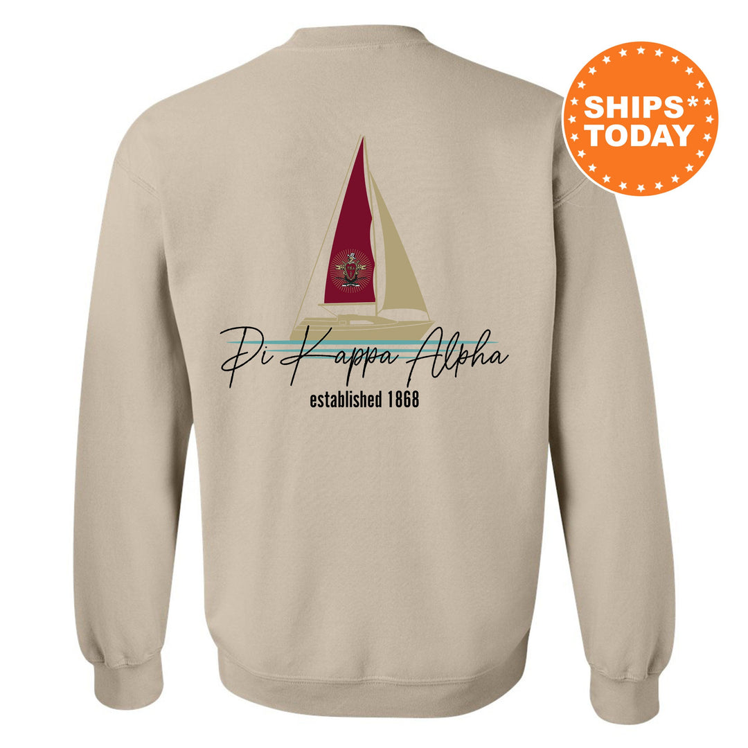 a white sweatshirt with a sailboat on it