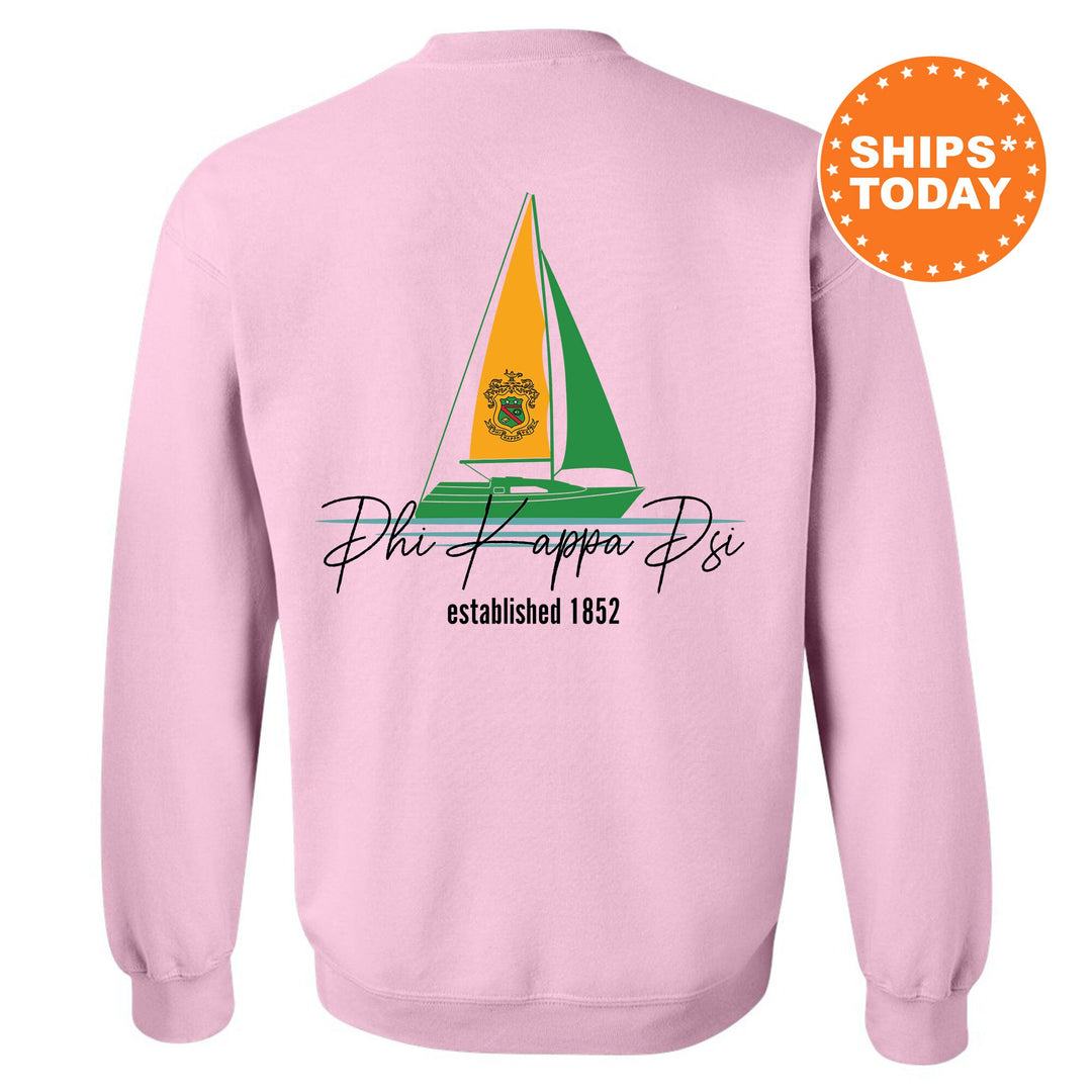 a pink sweatshirt with a sailboat on it