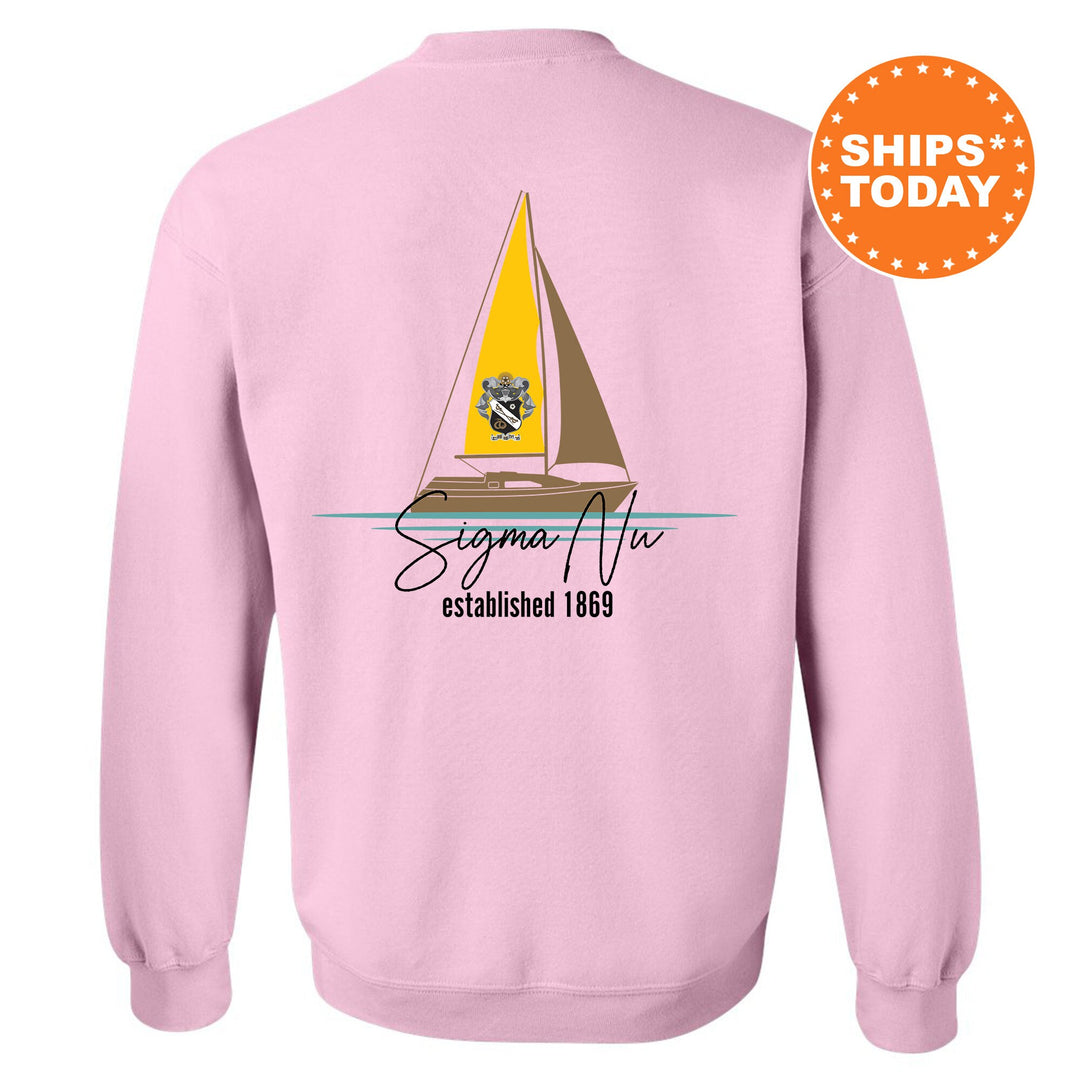 a pink sweatshirt with a sailboat on it