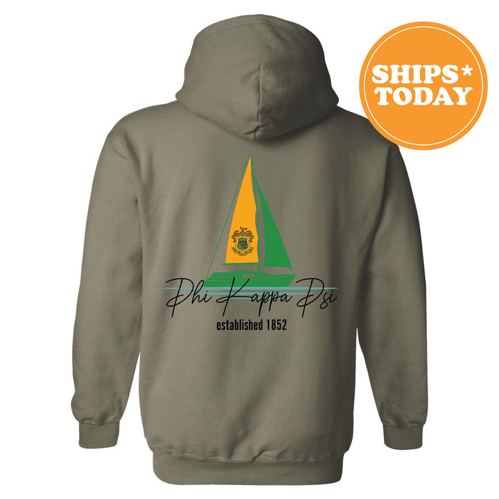 a gray hoodie with a yellow and green sailboat on it